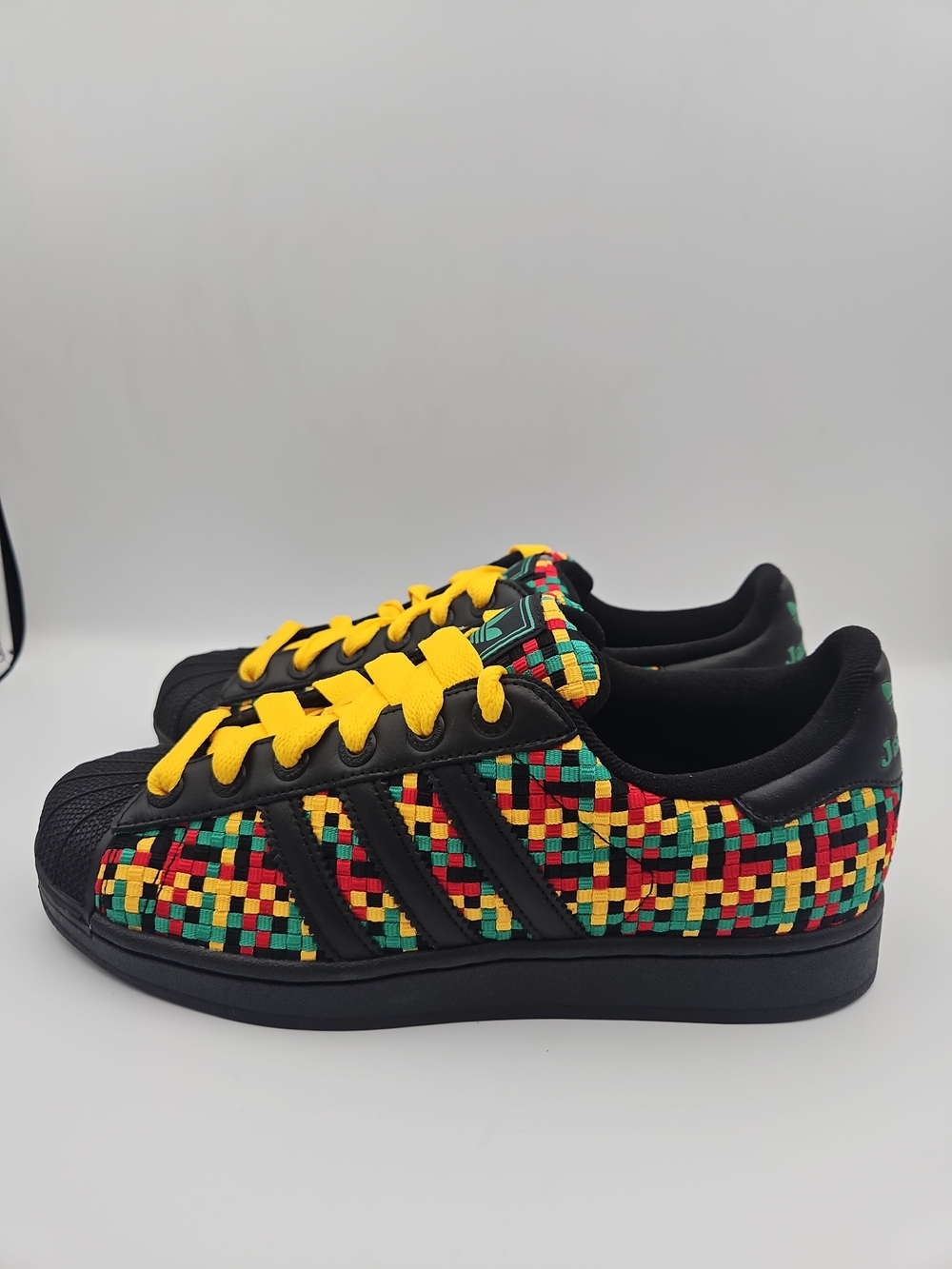adidas Black Sneakers with Red, Yellow & Green Mosaic Pattern and Yellow Laces
